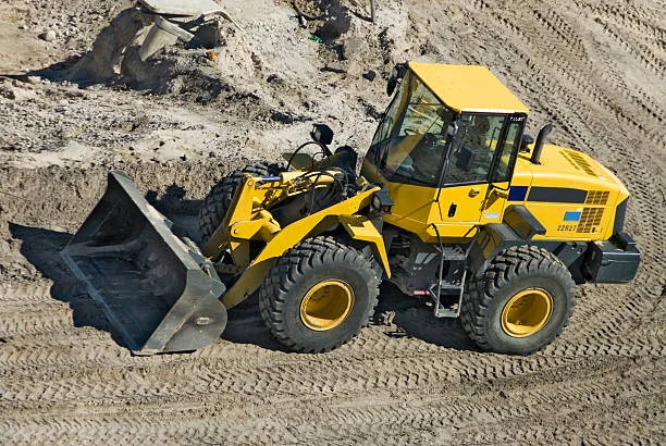 Wheel loader moving material on a job site