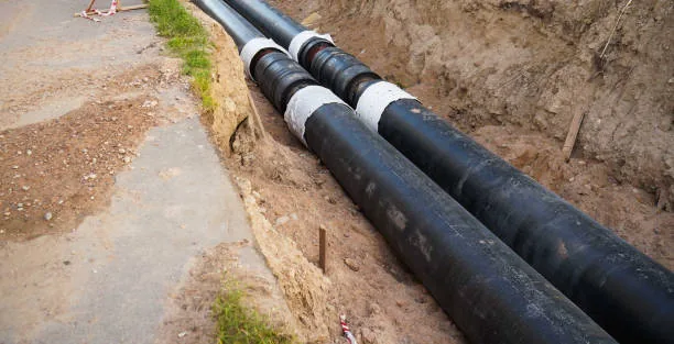 Large diameter utility pipes laid in open trench